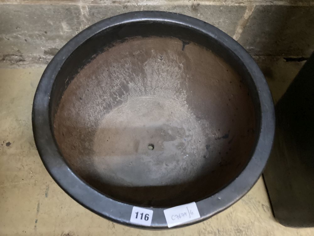 A circular grey glazed garden planter, width 46cm, height 29cm